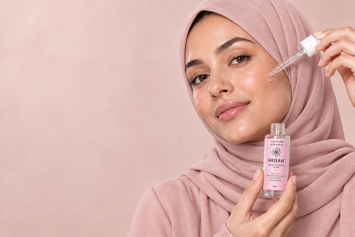 Woman wearing a hijab while applying Shifah Advance Clearing Serum